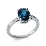 Ring 18 kt WG, 18 Brill. 0,08 ct, TW-si, 1 Topas 2,19 ct Lond. blue