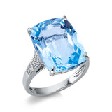 Ring 18 kt WG, 34 Brill. 0,19 ct, TW-si, 1 Topas 16,20 ct sky blue