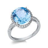 Ring 18 kt WG, 42 Brill. 0,19 ct, TW-si, 1 Topas 6,20 ct sky blue