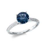 Ring 18 kt WG, 44 Brill. 0,15 ct, TW-si, 1 Topas 1,37 ct Lond. blue