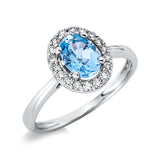 Ring 18 kt WG, 8 Brill. 0,08 ct, TW-si, 10 Brill. 0,12 ct, TW-si, 1 Topas 0,90 ct blau