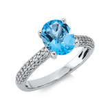 Ring 18 kt WG, 53 Brill. 0,20 ct, TW-si, 1 Topas 2,50 ct blau