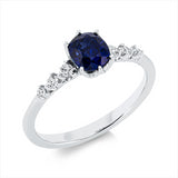 Ring 18 kt WG, 6 Brill. 0,14 ct, TW-si, 1 Saphir 1,09 ct blau