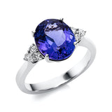 Ring 18 kt WG, 6 Brill. 0,18 ct, TW-si, 1 Tansanit 3,54 ct blau