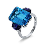 Ring 18 kt WG, 1 Topas 13,50 ct blau, 2 Iolith 1,40 ct blau