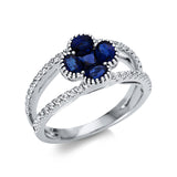 Ring 18 kt WG, 40 Brill. 0,27 ct, TW-vsi, 1 Saphir 0,21 ct blau, 4 Saphire 0,97 ct blau