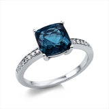 Ring 18 kt WG, 6 Brill. 0,05 ct, TW-si, 10 Brill. 0,06 ct, TW-si, 1 Topas 2,70 ct Lond. blue