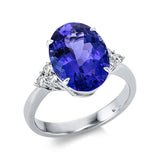 Ring 18 kt WG, 6 Brill. 0,21 ct, TW-si, 1 Tansanit 5,06 ct blau